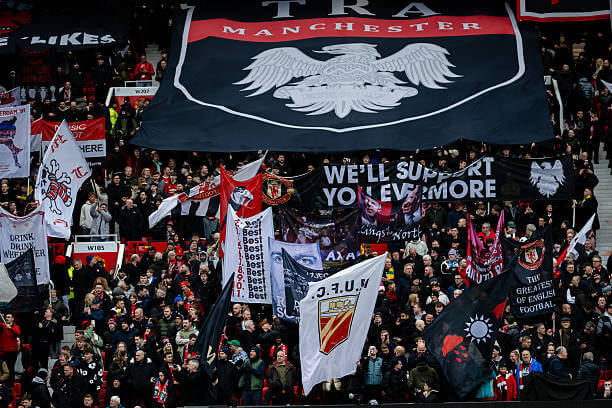 Why football has become so popular: A general View of Manchester United fans during the Premier League match.