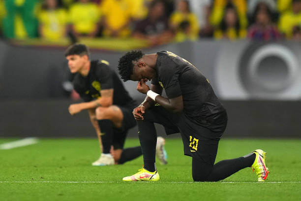 Where football was invented: Vinicius Junior takes a knee in support of anti-racism prior to an International Friendly match for Brazil.