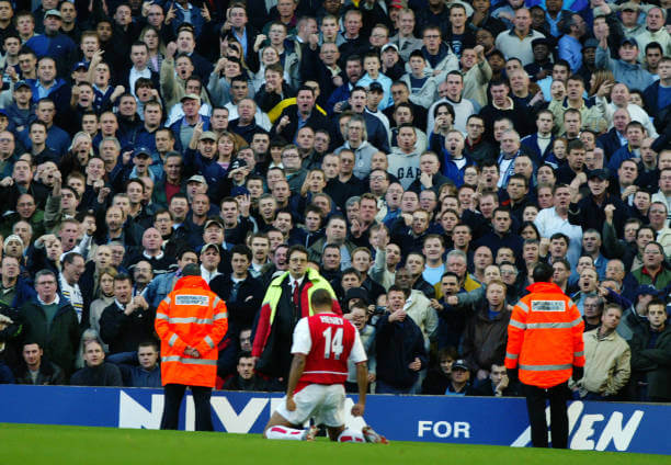 Top derbies in football: Thierry Henry celebrates his goal in front of the Tottenham Hotspur fans during the FA Barclaycard Premiership match between Arsenal and Tottenham Hotspur on November 16, 2002 at Highbury.