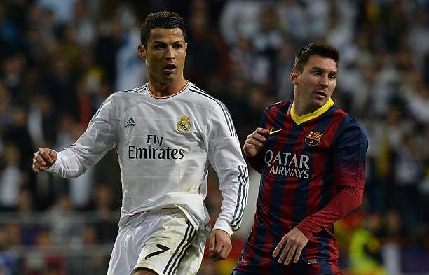 Top derbies in football: Cristiano Ronaldo and Lionel Messi look on during the "Clasico" match at the Santiago Bernabeu stadium on March 23, 2014.