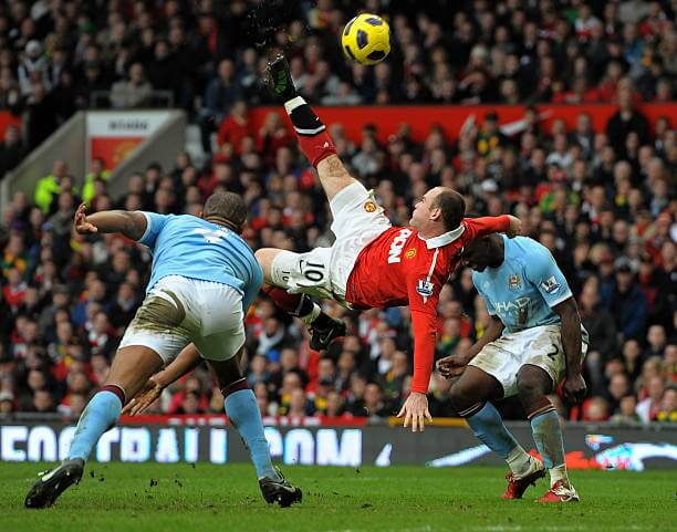 Top derbies in football: Wayne Rooney scores with an overhead kick during the Premier League match between Manchester United and Manchester City at Old Trafford on February 12, 2011.