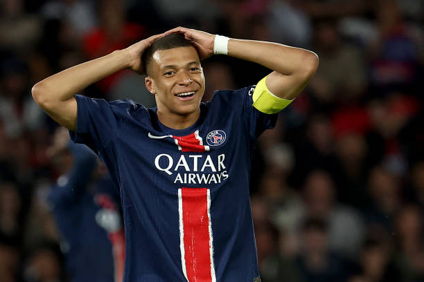 Kylian Mbappe reacts after missing a goal opportunity during the Ligue 1 match between PSG and Toulouse at the Parc des Princes.