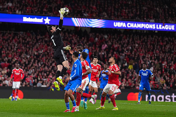 Benfica vs Real Madrid Review: Thibaut Courtois makes a save during the UEFA Champions League 2025/26 Play-offs First Leg match between Benfica and Real Madrid at Estádio da Luz on February 17, 2026.