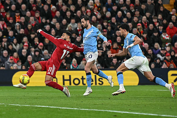 Liverpool vs Manchester City Review: Mohamed Salah clashes with Bernardo Silva during the Premier League match between Liverpool and Manchester City at Anfield on February 08, 2026.