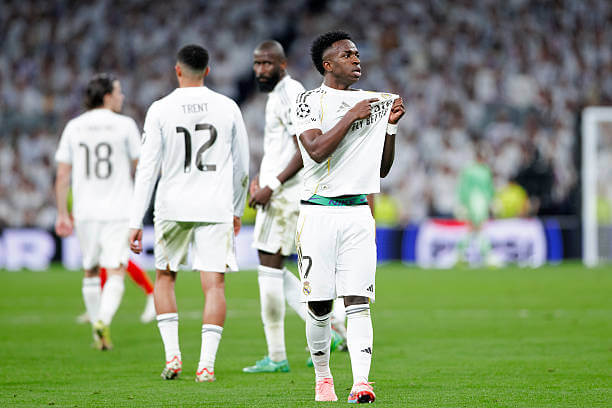 Champions League Roundup, Playoff Round: Vinicius Jr celebrates his goal during the UEFA Champions League 2025/26 Knockout Play-off second leg match between Real Madrid and Benfica at the Santiago Bernabeu on February 25, 2026.
