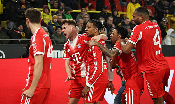Dortmund vs Bayern Munich Review: Joshua Kimmich celebrates his goal with his teammates during the Bundesliga match between Dortmund and Bayern Munich at the Signal Iduna Park on February 28, 2026.
