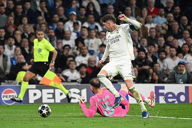 Real Madrid vs Manchester City Review: Federico Valverde evades Gianluigi Donnarumma to score his first goal of the game during the UEFA Champions League 2025/26 Round of 16 First Leg match between Real Madrid and Manchester City at the Santiago Bernabeu on March 11, 2026.