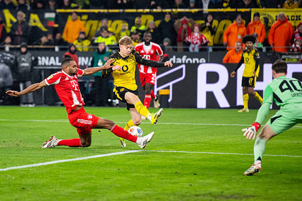 Dortmund vs Bayern Munich Review: Jonathan Tah blocks Daniel Svensson's shot during the Bundesliga match between Dortmund and Bayern Munich at the Signal Iduna Park on February 28, 2026.