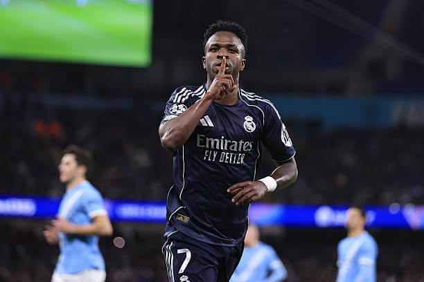 Champions League Roundup, Round of 16: Vinicius Junior celebrates his goal during the UEFA Champions League 2025/26 Round of 16 Second Leg match between Manchester City and Real Madrid at the Etihad Stadium on March 17, 2026.