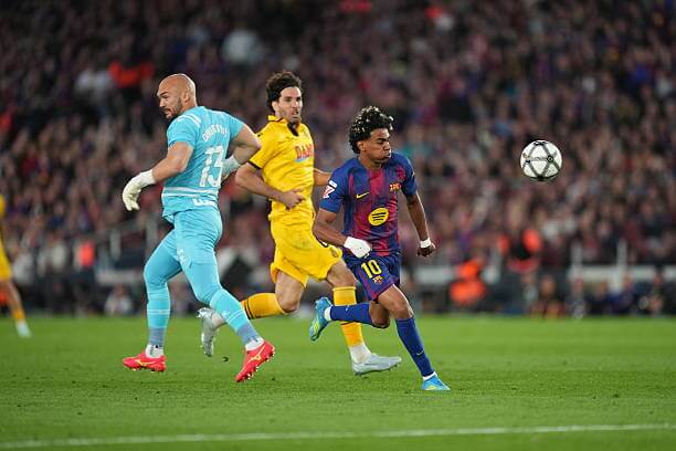 Barcelona vs Espanyol Review: Lamine Yamal runs with the ball past Marko Dmitrovic and scores during the La Liga match between Barcelona and Espanyol at Camp Nou on April 11 , 2026.
