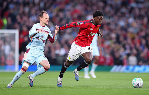 Manchester United vs Brentford Review: Kobbie Mainoo in action during the Premier League match between Manchester United and Brentford at Old Trafford on April 27, 2026.
