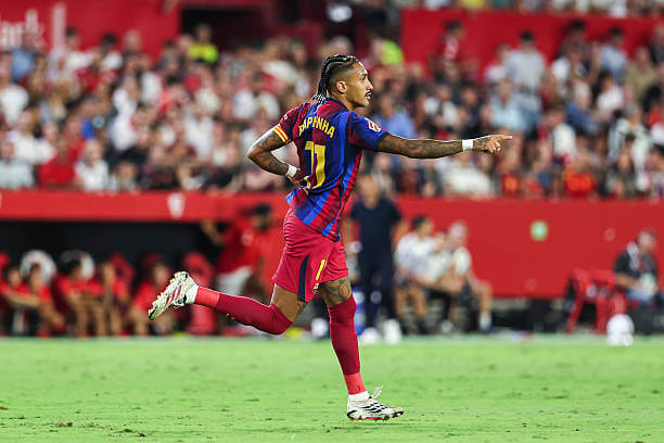 Sevilla vs Barcelona Review: Raphinha celebrates his first goal of the game during the LaLiga match between Sevilla and Barcelona at the Ramon Sanchez Pizjuan on September 19, 2026.