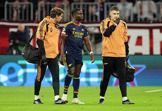 Bayern Munich vs Arsenal Review: Bukayo Saka receives medical attention after sustaining an injury during the UEFA Champions League 2026/27 League Phase MD3 match between Bayern Munich and Arsenal at the Allianz Arena on October 21, 2026.